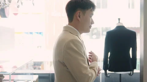 Asia groom try on suit at fitting room store ready for wedding day. Stock Footage 301375066