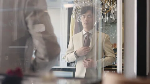 Asia groom try on suit at fitting room store ready for wedding day. Stock-Footage 301375342