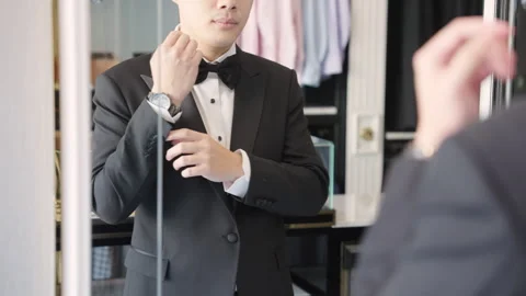 Asia groom try on suit at fitting room store ready for wedding day. Stock Footage 301375767