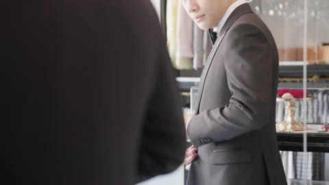 Asia groom try on suit at fitting room store ready for wedding day. Stock Footage 301375971
