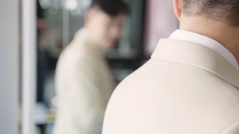 Asia groom try on suit at fitting room store ready for wedding day. Stock Footage 301376086