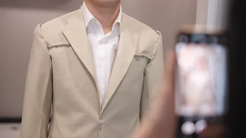 Asia groom try on suit at fitting room store ready for wedding day. Stockbeeldmateriaal 301394169