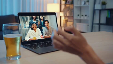 Asia lady drinking beer having fun night party event online by phone at home. Stock Footage 153187720
