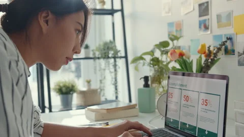 Asia lady focus on presentation work in laptop for  remote meeting at house. Stock Footage 153220958