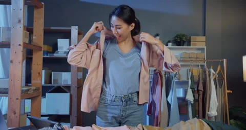 Asia lady live streaming on tablet show new collection produce talk to customer. Stock Footage 166672509