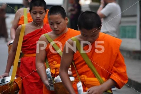 Asia Laos Luang Prabang Places of Worship Monks Receiving Alms Stock Photos