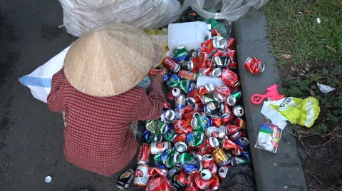 Asia poverty, inequality, woman recycling cans plastic, colorful, trash, Vietnam Stock Footage