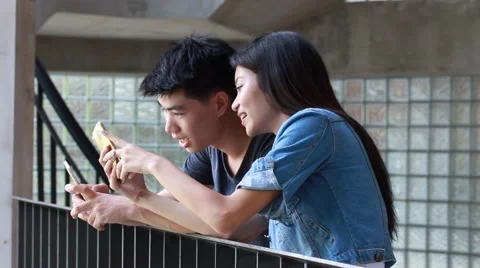 Asia thai lover using her smart phone Stock Footage 63998910