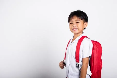 Asian adorable toddler smiling happy wearing student thai uniform standing Stock Photos