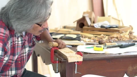 Asian aged retirement man with silver hair enjoys DIY hobby in carpentry st.. Stock Footage 243190866