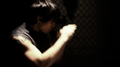 Asian American man shadow boxes. Medium shot. Stock Footage 33866784
