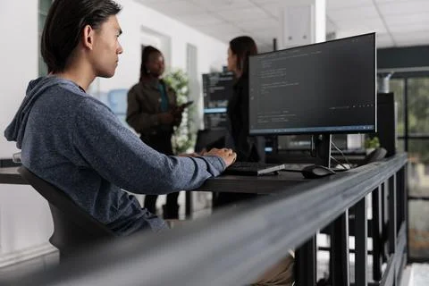 Asian app developer analyzing compiling html code Stock Photos