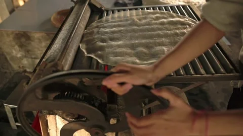 Asian Apprentice Adjusting. Hands Operate Noodle Roller Gear. Young Worker Video stock 330835581