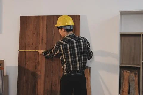 Asian architect and engineer team checking architectural house model using .. Stock Photos
