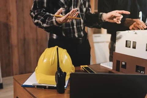 Asian architect and engineer team checking architectural house model using .. Foto stock