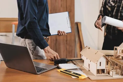 Asian architect and engineer team checking architectural house model using .. Foto stock