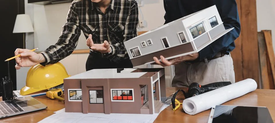 Asian architect and engineer team checking architectural house model using .. Foto stock