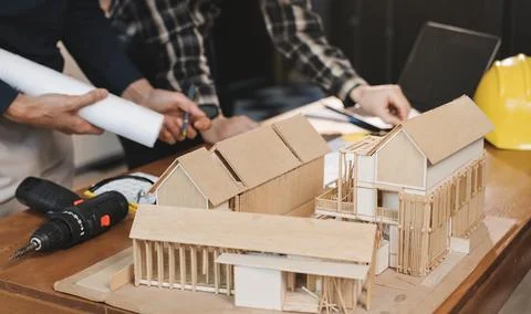 Asian architect and engineer team checking architectural house model using .. Foto stock