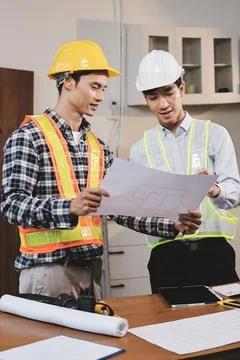 Asian architect and engineer team checking architectural house model using .. Foto stock