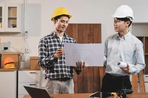 Asian architect and engineer team checking architectural house model using .. Foto stock