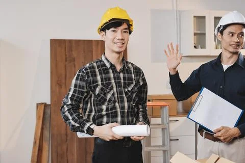 Asian architect and engineer team checking architectural house model using .. Foto stock