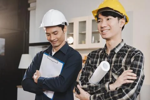 Asian architect and engineer team checking architectural house model using .. Foto stock