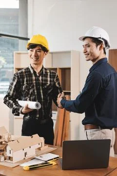 Asian architect and engineer team checking architectural house model using .. Foto stock