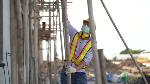 Asian architect checking construction site outdoors at village . contractor w Stock Footage 146445635