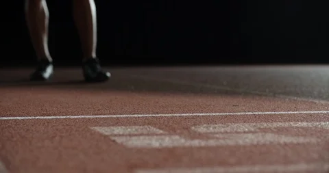 Asian athlete having an evening training, putting himself on starting position Video stock 117539124