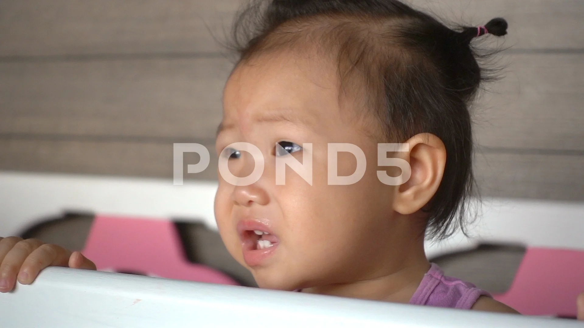 Asian baby girl is crying on baby Stock Video Pond5