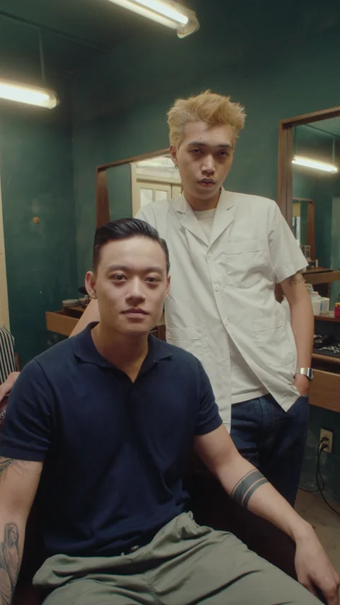 Asian Barber and Client Posing on Camera in the Barbershop Stock Footage 238357192