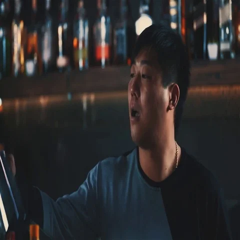 Asian bartender barman doing tricks with shaker bar counter HD slow motion video Stock Footage 69377294