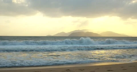 Asian beach background. The trail of the sun on the waves in the sand. Large sun Stock Footage 146878522