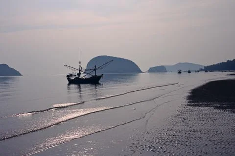 An Asian beach at dawn. Stock Photos