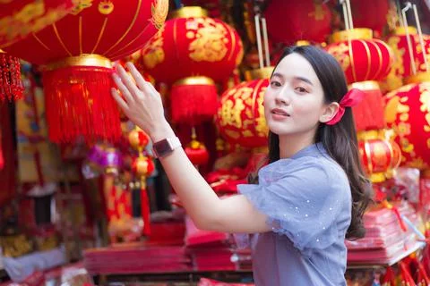 Asian beautiful girl in long hair wears a grey Chinese dress. Stock Photos