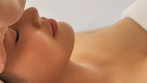 Asian beautiful woman are relaxing with facial and head massage spa Stock Footage