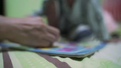Asian boy about 4 year old building paper jigsaws Stock Footage 150300456