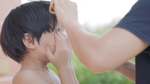 Asian boy about 4 year old got hair cut at home. Video stock 174020611