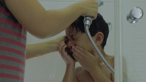 Asian boy being cleaned by his mother with soap and water. Video stock 156509750