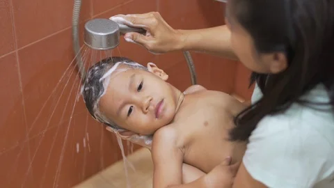 Asian boy being washed and showered Stock-Footage 86507037