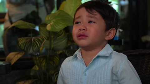 Asian boy crying in Restaurant Stock Footage 145213058
