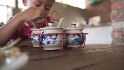 Asian boy curiously checking spice set Video stock 121091921