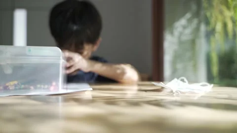 Asian boy doing his homework, drawing and painting picture. Video stock 158288706