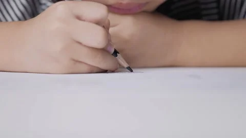 Asian boy doing his homework, drawing and painting picture. Stock Footage 160030367