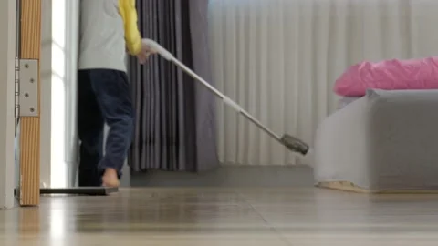 Asian boy doing house chore by cleaning the floor. Stock Footage 165681511