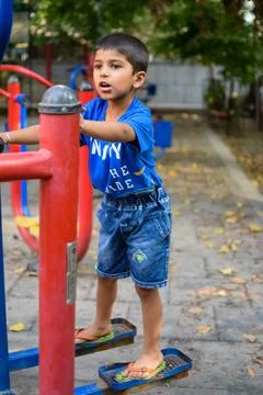 Asian boy doing routine exercise in society park during the morning time. C.. 스톡 사진