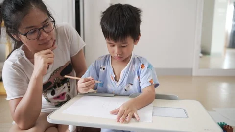 Asian boy drawing and study at home Stock Footage 128789688