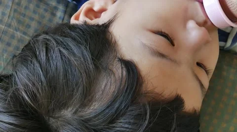 Asian boy drinking from bottle,close up 스톡 동영상 56697349