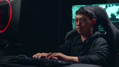 Asian Boy Hacker Using Computer Hacking And  Looking, Pose To Camera Stock-Footage 157191849