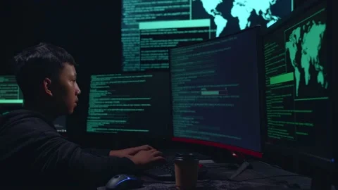 Asian Boy Hacker Using Multiple Computer Hacking And Success Downloading Data Stock Footage 157328360